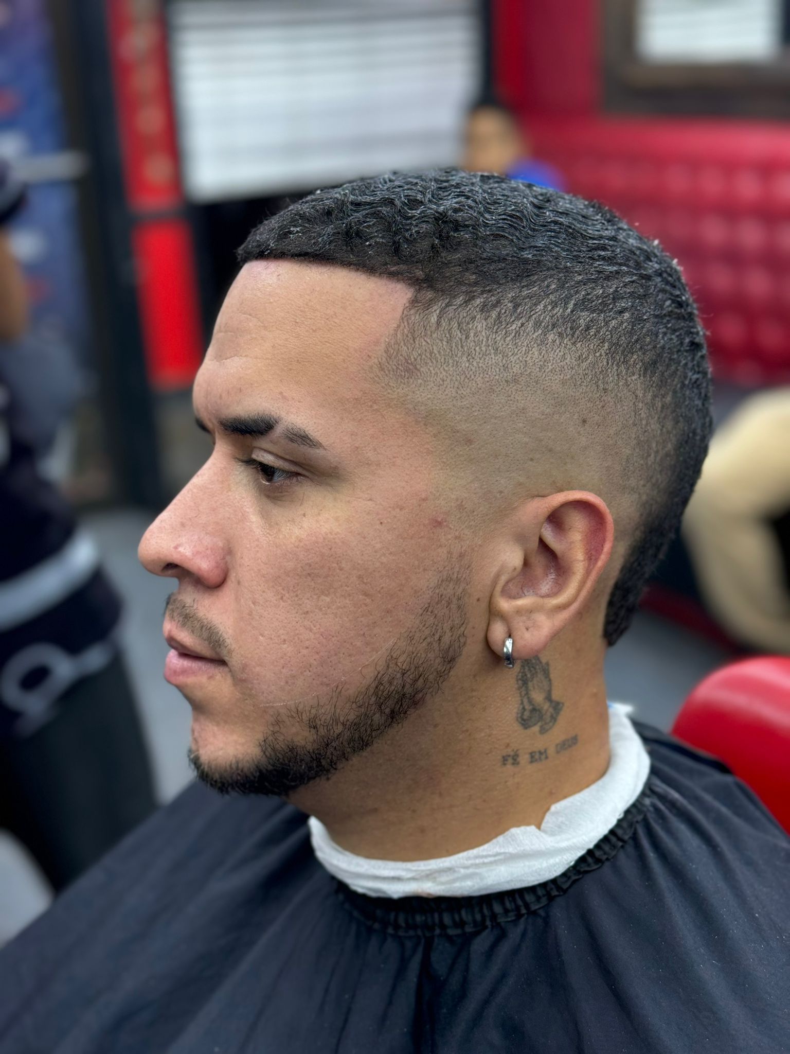 Curly fade with tattoo detail